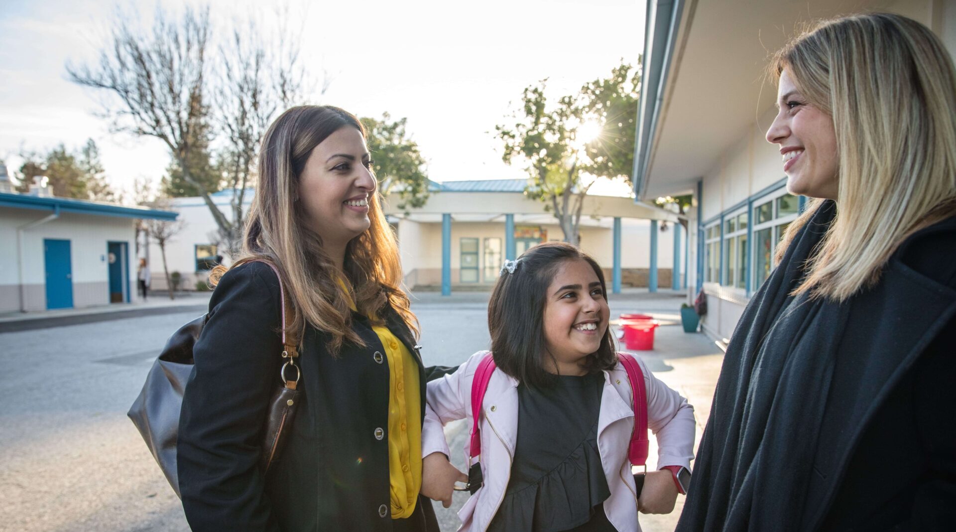 Teacher meeting with a family at school