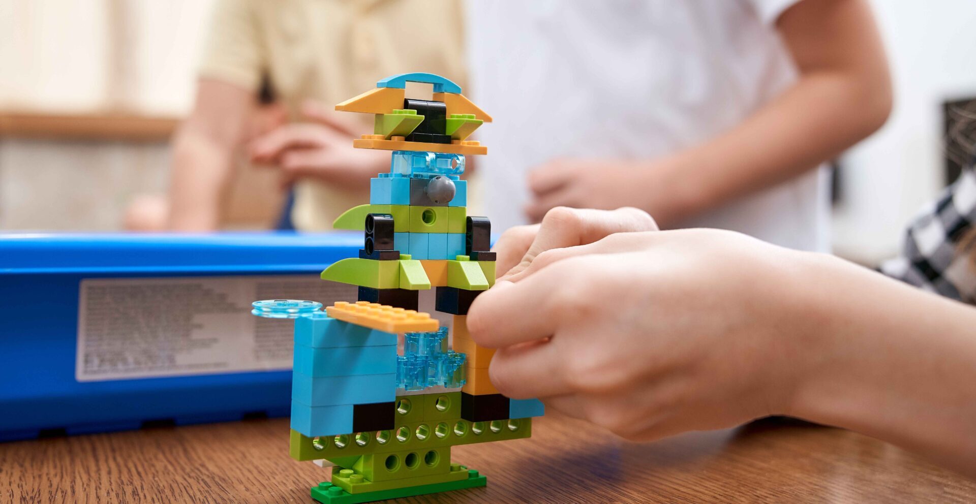 Student building a lego kit