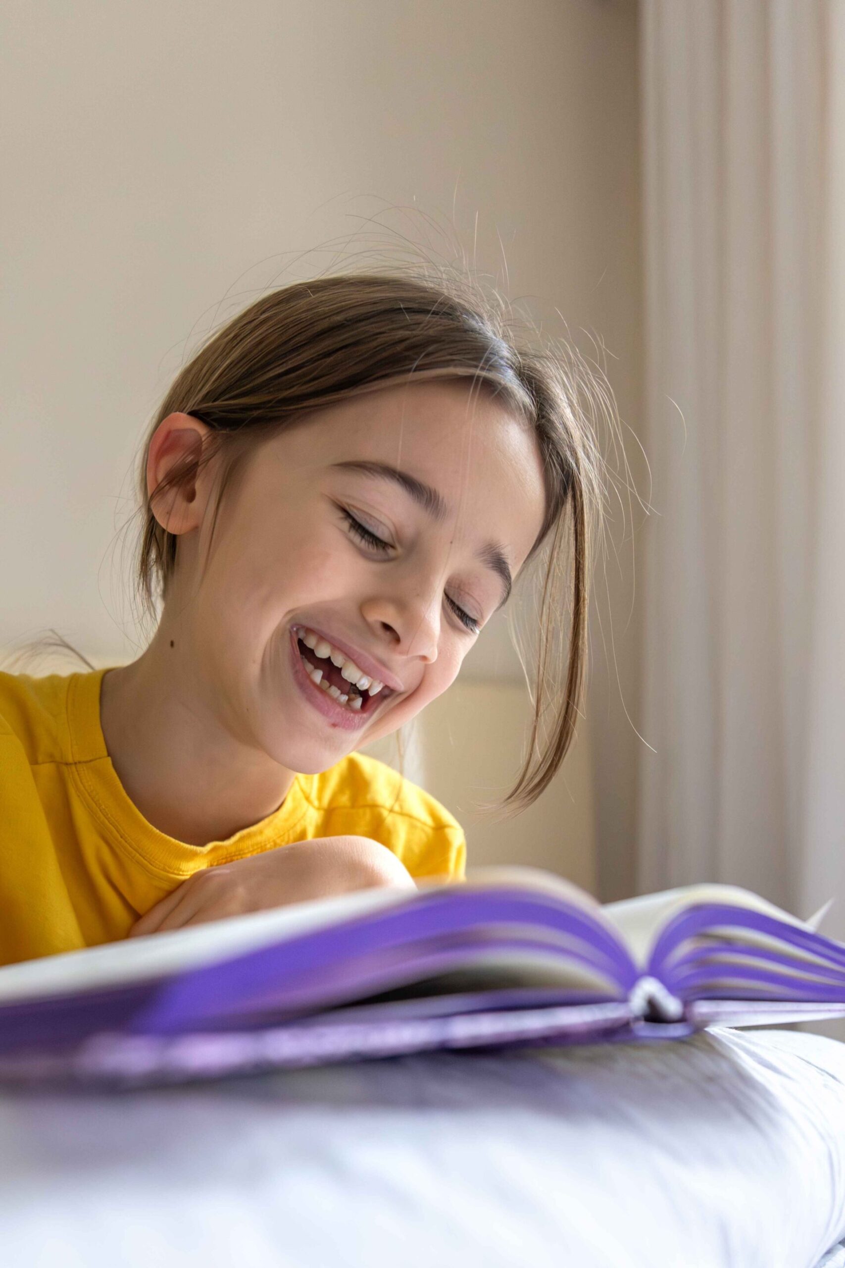 Happy girl reading a book independently 