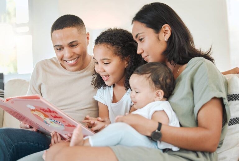 Family encouraging their daughter to read