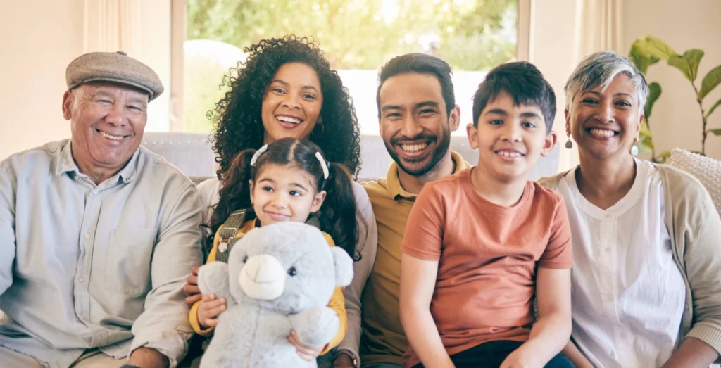 Portrait, smile and big family in home living room, bonding and having fun together. Happy, children