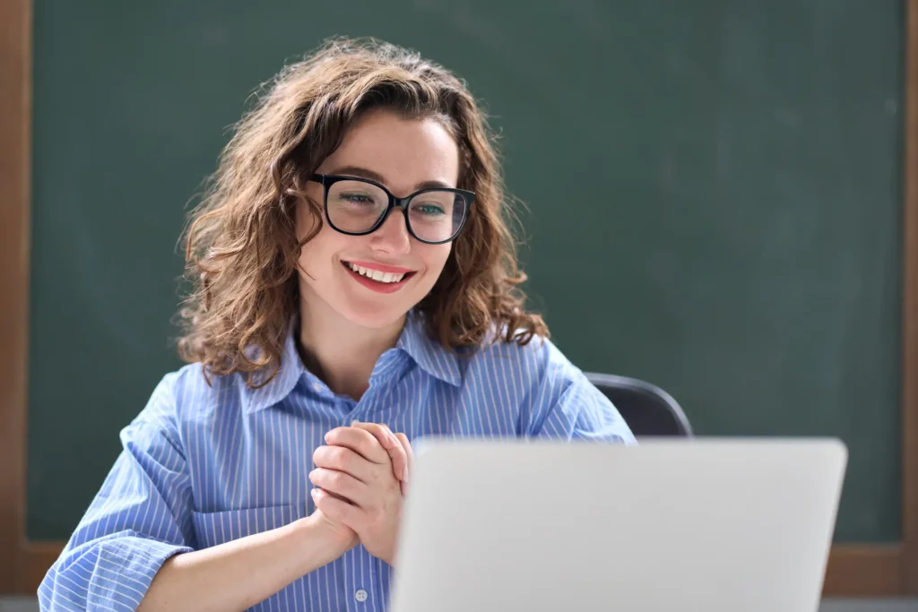 Teacher looking at laptop