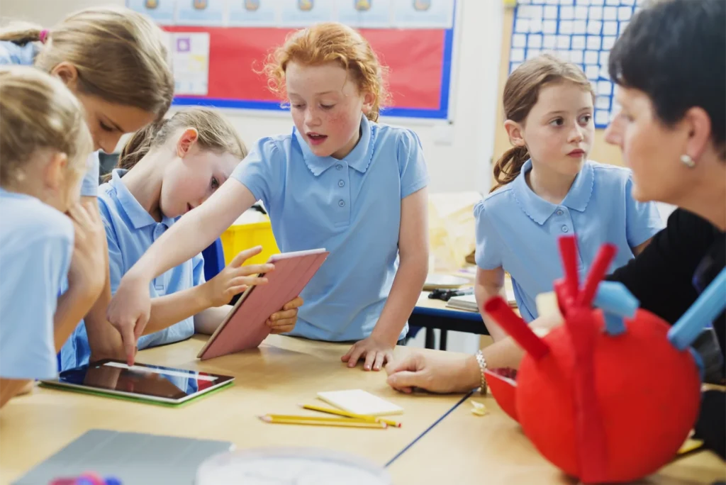 a student excitedly works at her desk